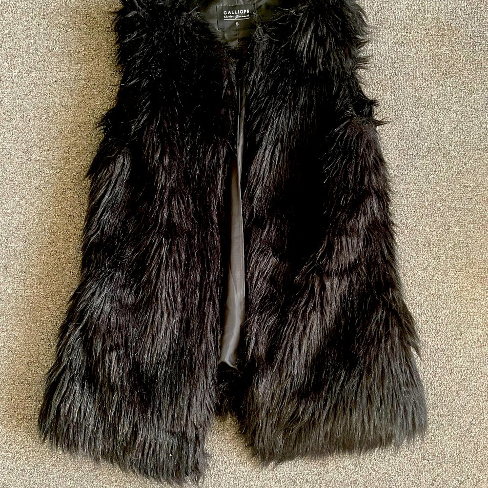 Black faux fur vest.